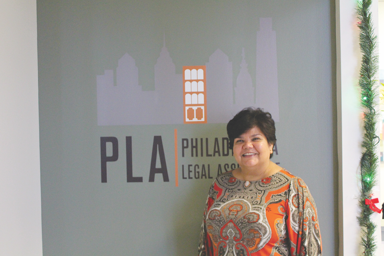 Anita posing in front of PLA's new offices in 2014