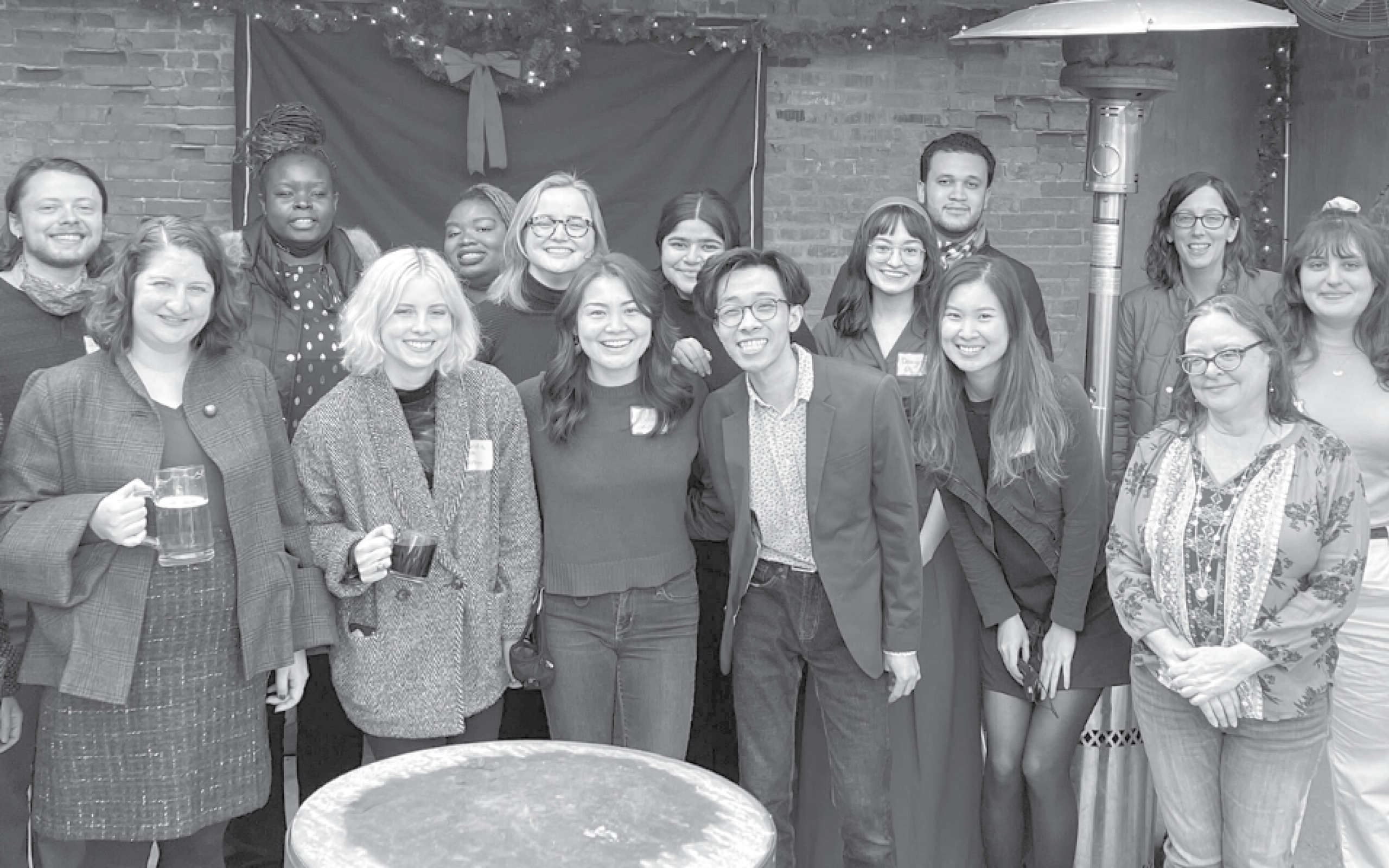 PLA staff pose for a picture at the holiday party