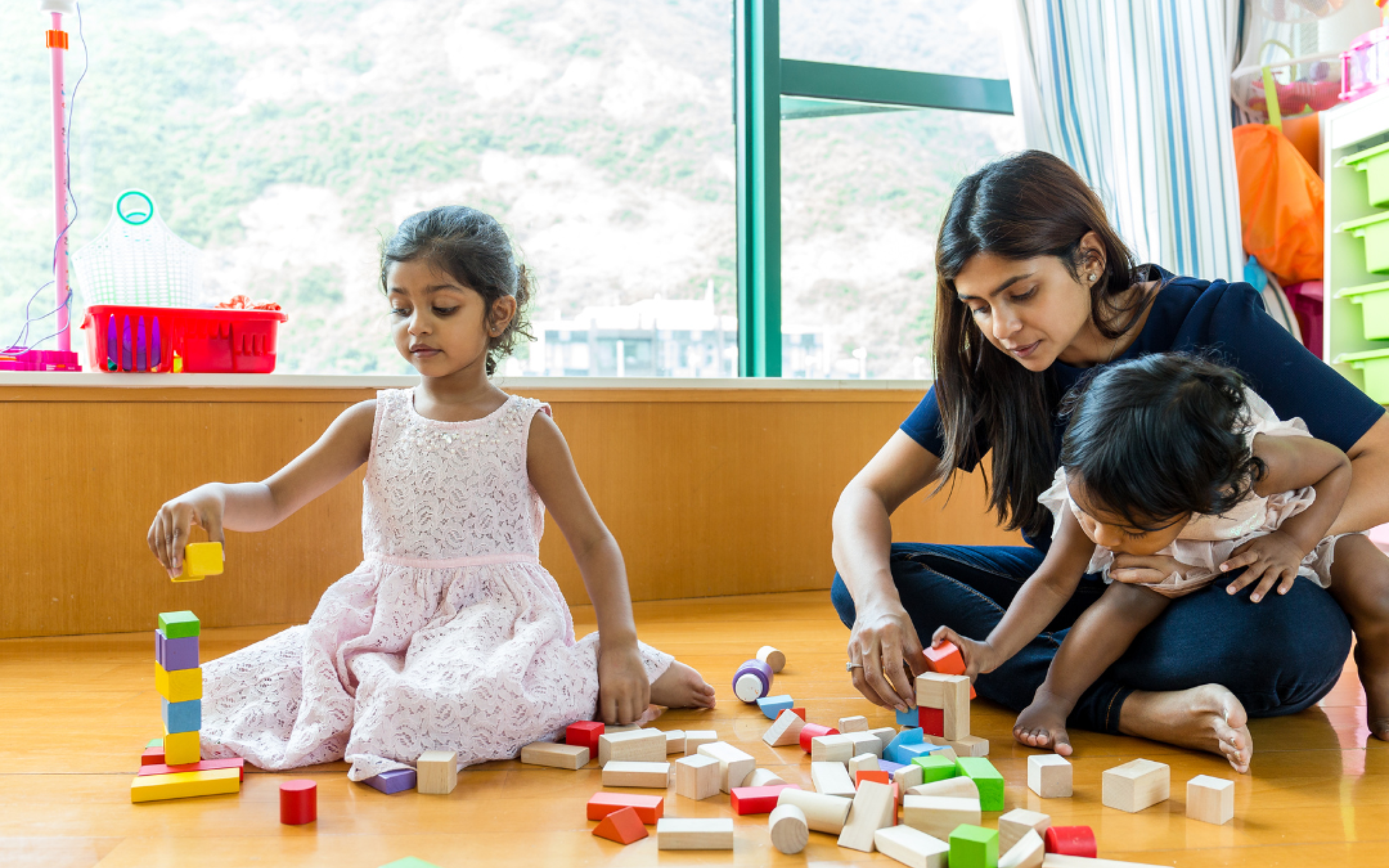 a mother plays with her two children