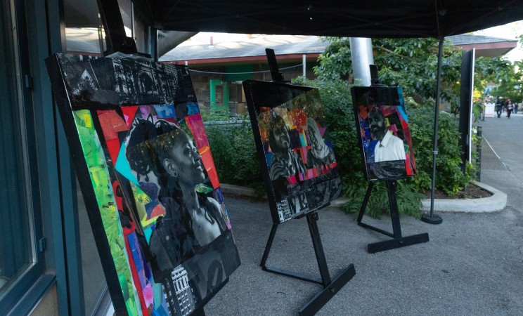 The three portraits on display on black easels at the Jubilee for Justice 