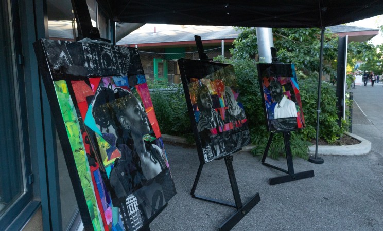 The three portraits on display on black easels at the Jubilee for Justice