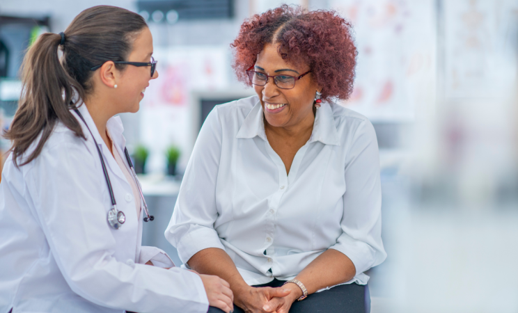 A doctor talks to her patient