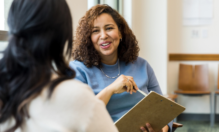 A paralegal meets with a client