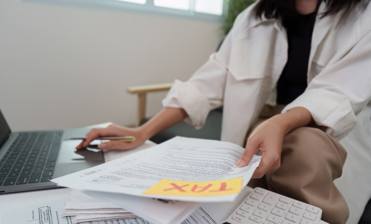 A tax preparer handles documents 