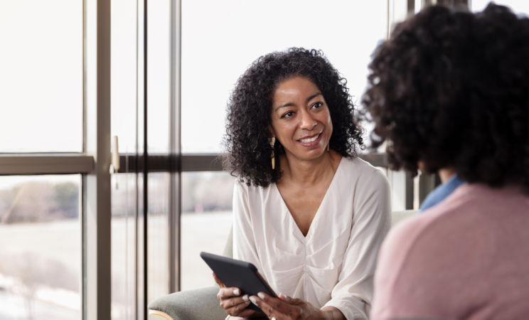A woman counsels another woman