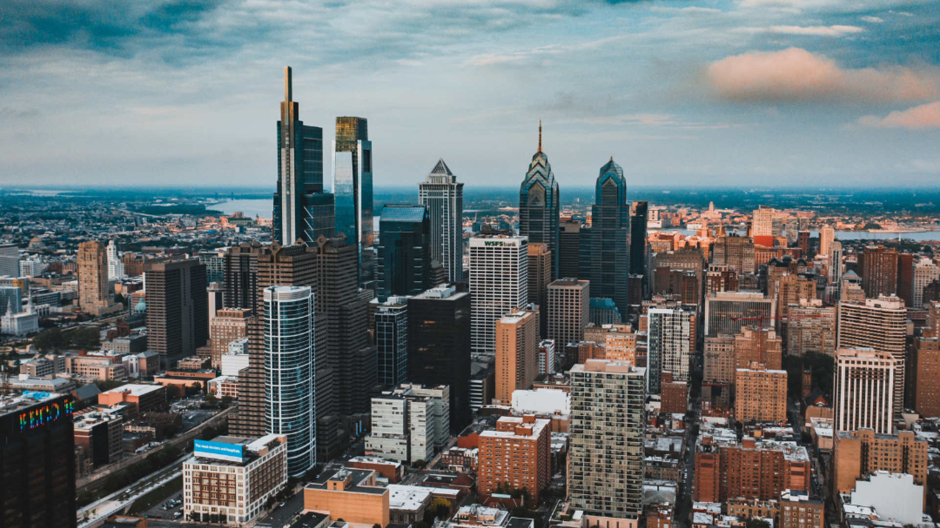 The major skyscrapers of the Philadelphia skyline can be seen on a mostly cloudy day