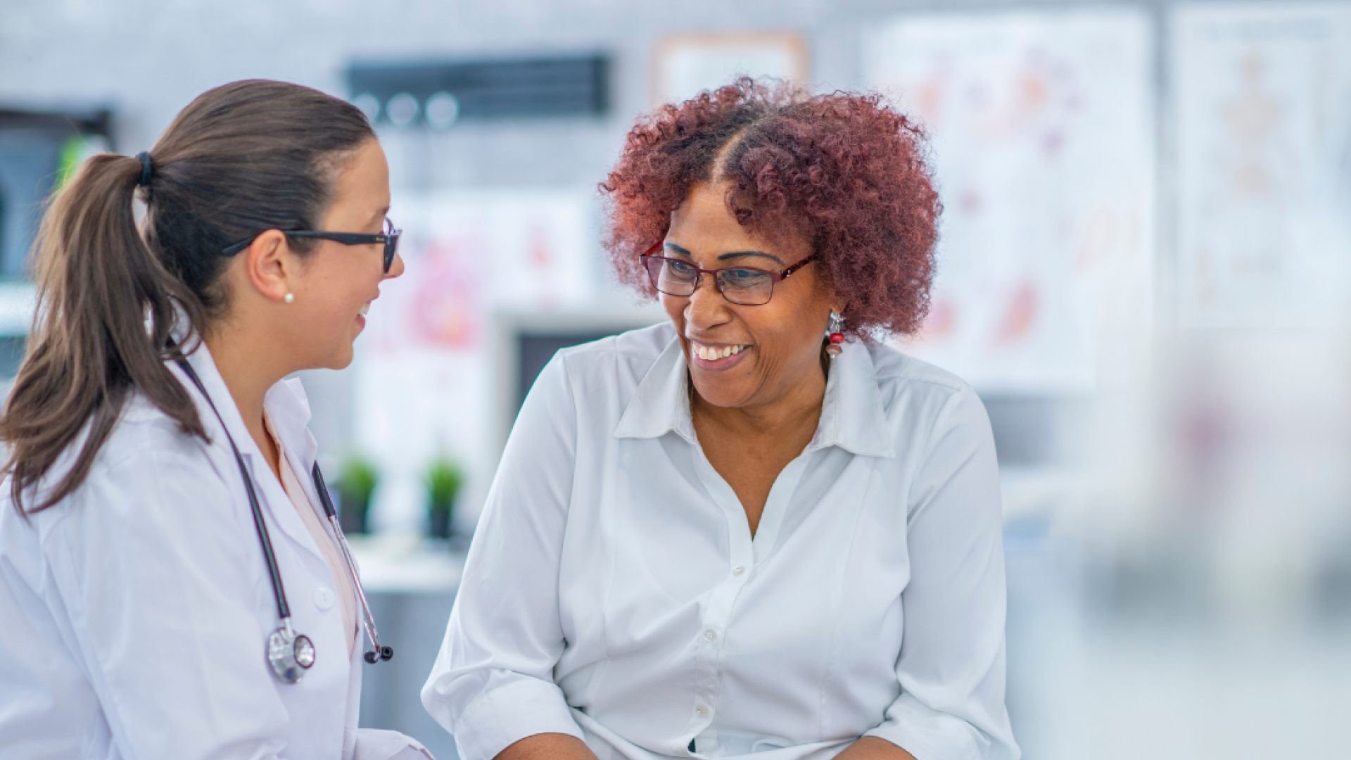 A woman talks with her doctor 