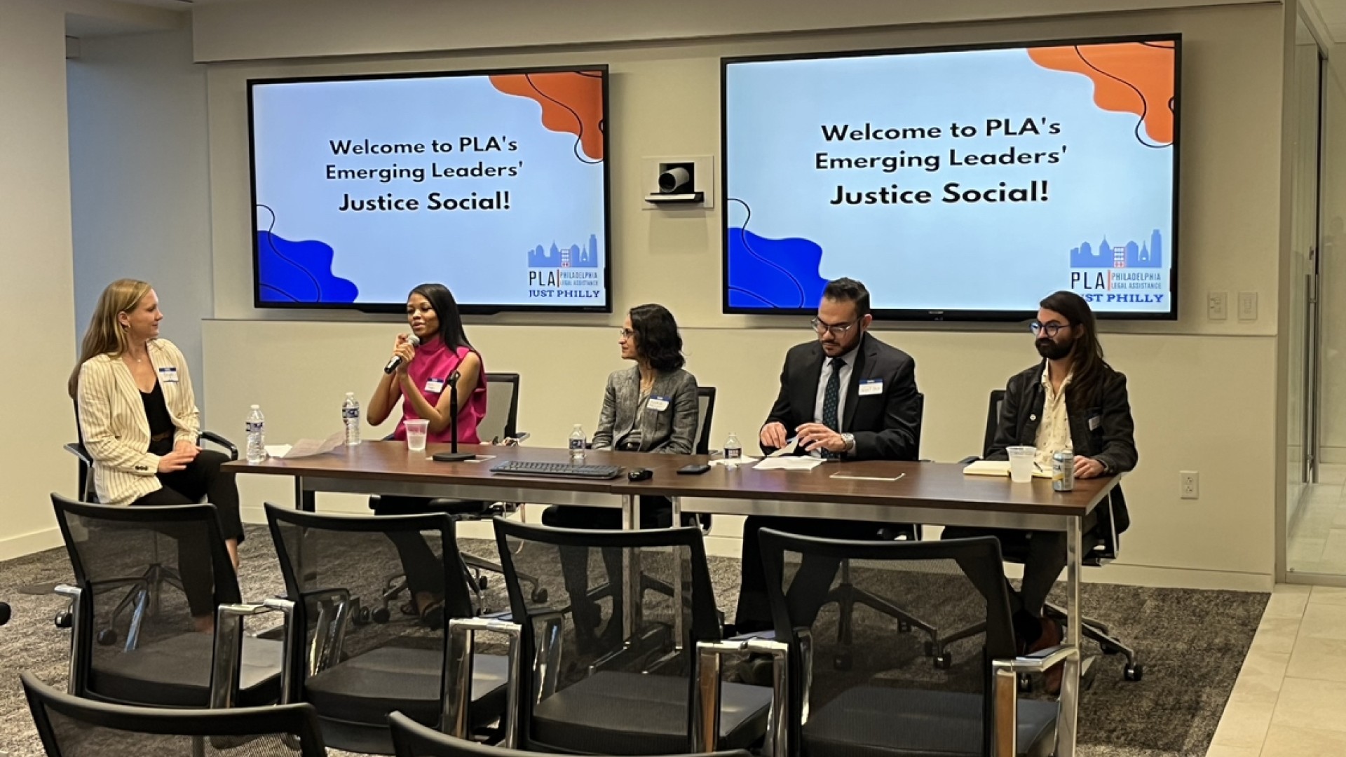 Five young professionals sit on a panel.