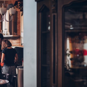 A couple cook together at home; Photo by Soroush Karimi on Unsplash