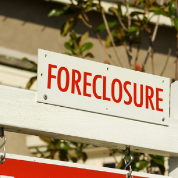 A red and white sign reads "foreclosure"