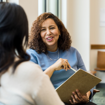 A paralegal meets with a client