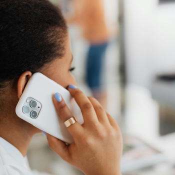 A woman makes a call on a cell phone
