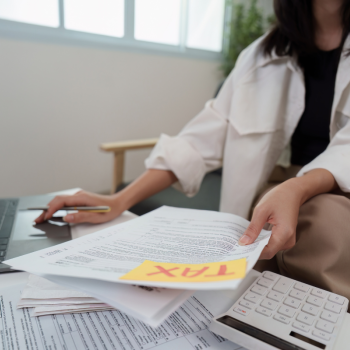 A tax preparer handles documents 