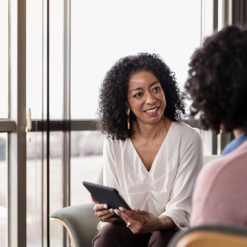 A woman counsels another woman